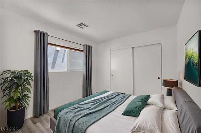 4020 Pistachio Nut Ave, Las Vegas, NV 89115 - bedroom featuring light wood-style floors and a closet