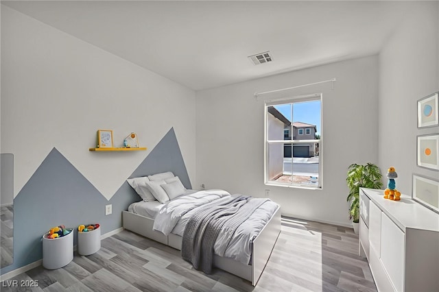 4020 Pistachio Nut Ave, Las Vegas, NV 89115 - bedroom featuring light wood-type flooring and baseboards