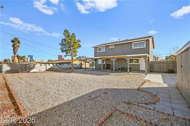 3208 Alcoa Ave, Las Vegas, NV 89102 - back of property with a fenced backyard and a patio