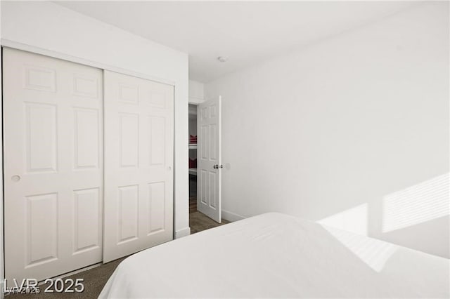 3208 Alcoa Ave, Las Vegas, NV 89102 - bedroom featuring dark carpet and a closet