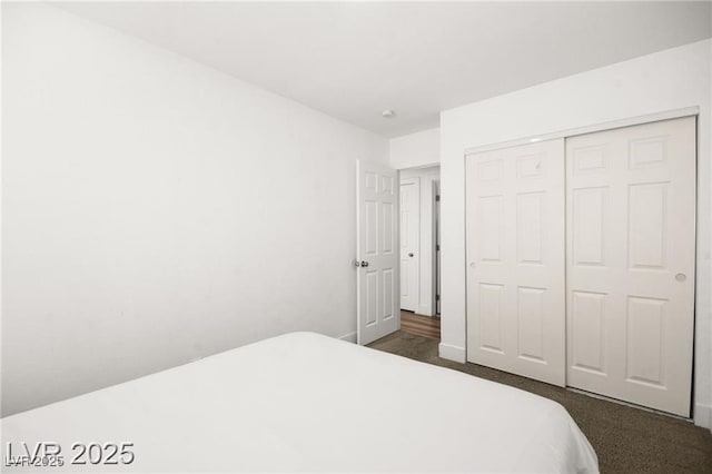 3208 Alcoa Ave, Las Vegas, NV 89102 - bedroom with dark carpet and a closet