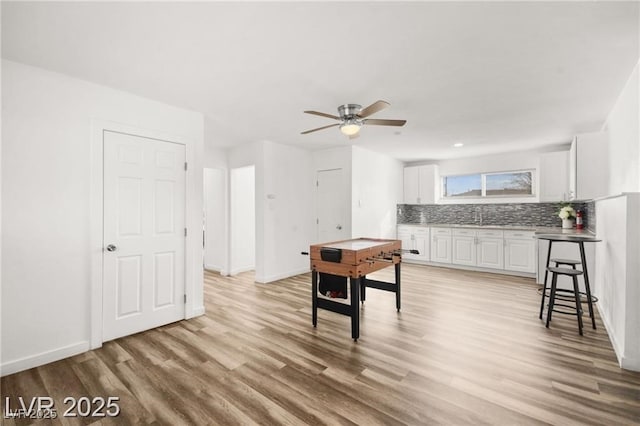 3208 Alcoa Ave, Las Vegas, NV 89102 - game room featuring light wood finished floors and a ceiling fan