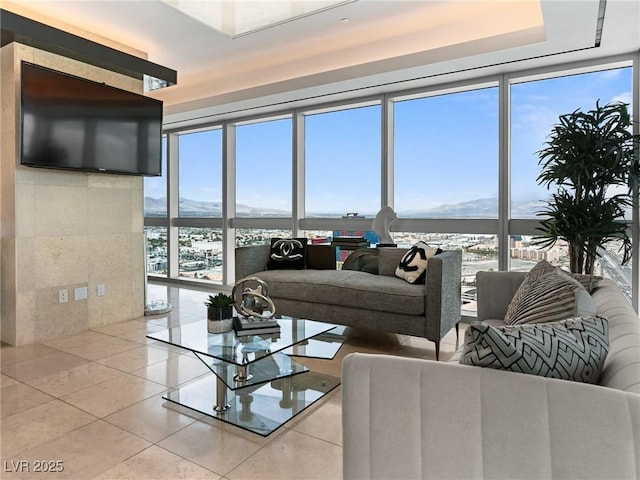 4471 Dean Martin Dr Unit 4308, Las Vegas, NV 89103 - living area with floor to ceiling windows, tile patterned floors, plenty of natural light, and a water view