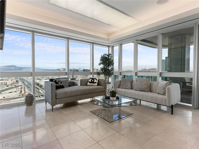 4471 Dean Martin Dr Unit 4308, Las Vegas, NV 89103 - living room with plenty of natural light, tile patterned floors, floor to ceiling windows, and a mountain view