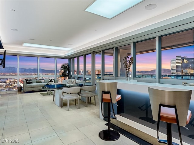 4471 Dean Martin Dr Unit 4308, Las Vegas, NV 89103 - interior space featuring a wall of windows, a city view, and tile patterned flooring