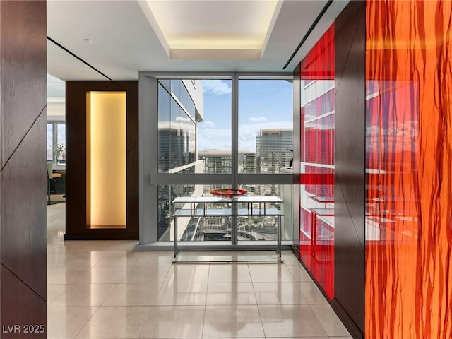 4471 Dean Martin Dr Unit 4308, Las Vegas, NV 89103 - corridor featuring expansive windows, tile patterned floors, a raised ceiling, and a view of city