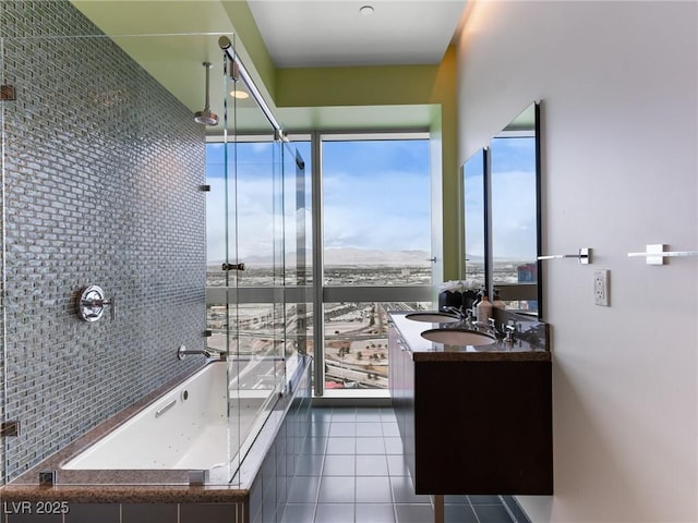 4471 Dean Martin Dr Unit 4308, Las Vegas, NV 89103 - bathroom with tile patterned flooring, double vanity, and tiled tub
