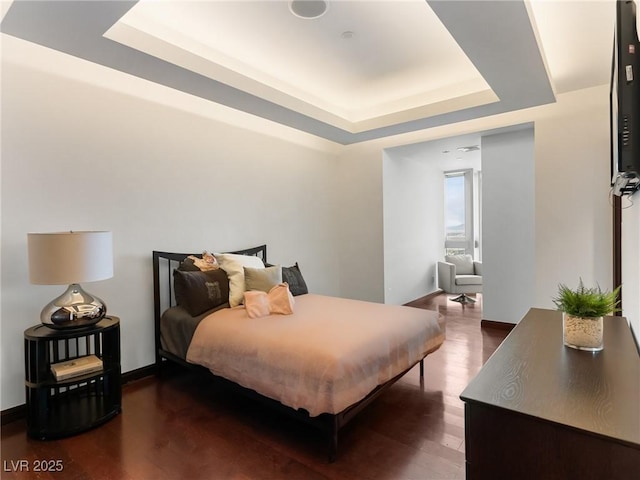 4471 Dean Martin Dr Unit 4308, Las Vegas, NV 89103 - bedroom with a raised ceiling and wood finished floors