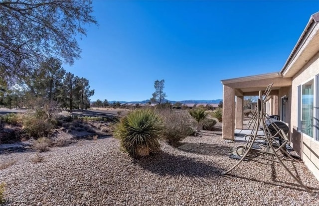 3109 Frigate Way N, Las Vegas, NV 89084 - view of yard featuring a patio and a mountain view