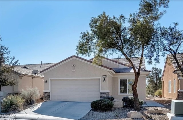 3109 Frigate Way N, Las Vegas, NV 89084 - ranch-style home featuring a garage, stucco siding, concrete driveway, and stone siding