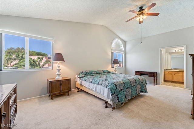 1337 Maplegrove Cir, Las Vegas, NV 89108 - bedroom with vaulted ceiling, light colored carpet, a textured ceiling, ceiling fan, and ensuite bathroom