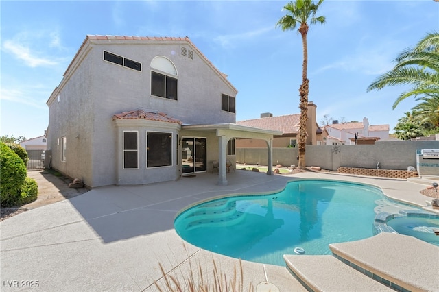 1337 Maplegrove Cir, Las Vegas, NV 89108 - view of swimming pool featuring a pool with connected hot tub, a patio area, and a fenced backyard
