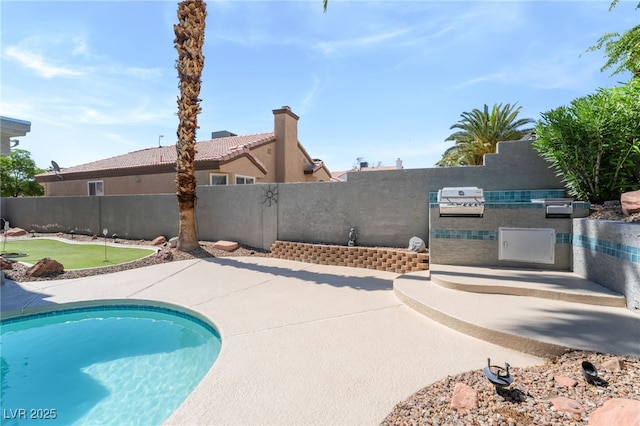 1337 Maplegrove Cir, Las Vegas, NV 89108 - view of swimming pool featuring a putting green, exterior kitchen, and a patio area