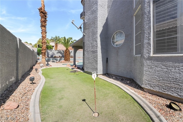 1337 Maplegrove Cir, Las Vegas, NV 89108 - fenced backyard with a putting area