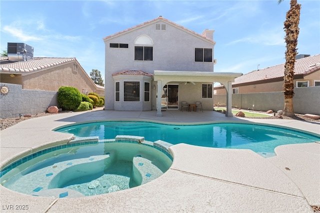 1337 Maplegrove Cir, Las Vegas, NV 89108 - view of swimming pool featuring a pool with connected hot tub, a patio area, and a fenced backyard