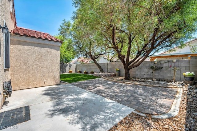8557 Hidden Pines Ave, Las Vegas, NV 89143 - fenced backyard featuring a patio area