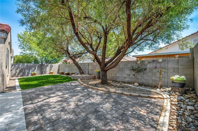 8557 Hidden Pines Ave, Las Vegas, NV 89143 - fenced backyard with a patio