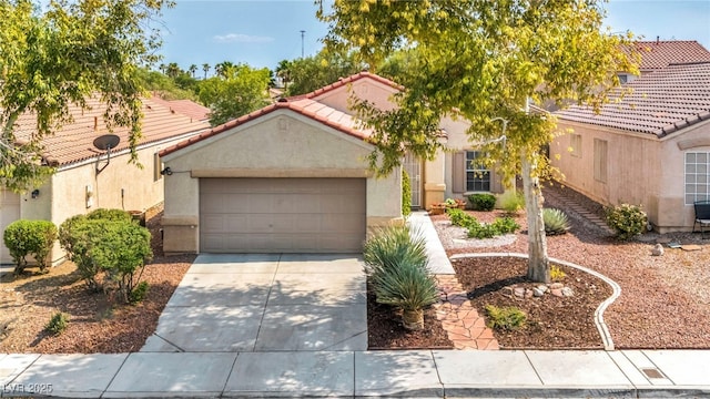 8557 Hidden Pines Ave, Las Vegas, NV 89143 - mediterranean / spanish home with a garage, driveway, stucco siding, and a tile roof