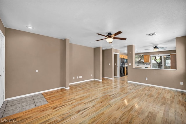 8557 Hidden Pines Ave, Las Vegas, NV 89143 - unfurnished living room with light wood-style floors, a ceiling fan, and recessed lighting