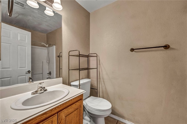 8557 Hidden Pines Ave, Las Vegas, NV 89143 - full bathroom featuring a shower, a textured wall, vanity, and tile patterned flooring