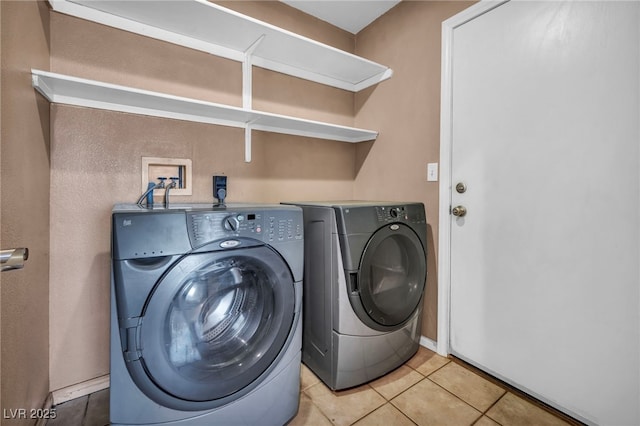 8557 Hidden Pines Ave, Las Vegas, NV 89143 - laundry room featuring separate washer and dryer and light tile patterned floors
