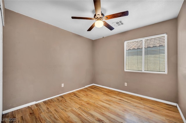 8557 Hidden Pines Ave, Las Vegas, NV 89143 - unfurnished room with ceiling fan and wood finished floors