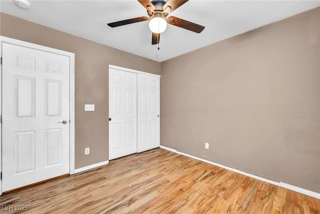 8557 Hidden Pines Ave, Las Vegas, NV 89143 - unfurnished bedroom with light wood-type flooring, a closet, and a ceiling fan