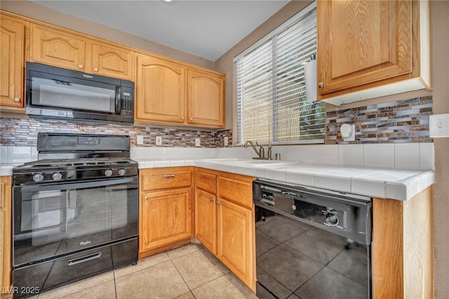 8557 Hidden Pines Ave, Las Vegas, NV 89143 - kitchen featuring black appliances, tasteful backsplash, tile countertops, and light tile patterned floors
