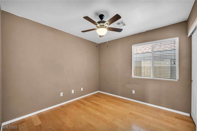 8557 Hidden Pines Ave, Las Vegas, NV 89143 - empty room featuring a ceiling fan and light wood-type flooring