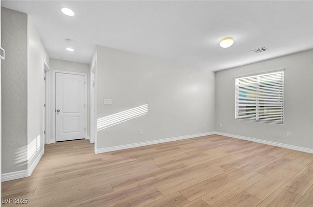 6373 Beavertail Pond Ave, Las Vegas, NV 89122 - empty room with light wood-style floors, recessed lighting, and a smoke detector