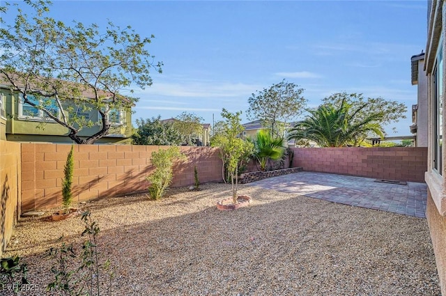 6373 Beavertail Pond Ave, Las Vegas, NV 89122 - fenced backyard with a patio