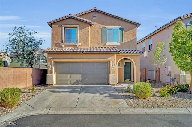 6373 Beavertail Pond Ave, Las Vegas, NV 89122 - mediterranean / spanish home featuring a tiled roof, driveway, stucco siding, and a garage