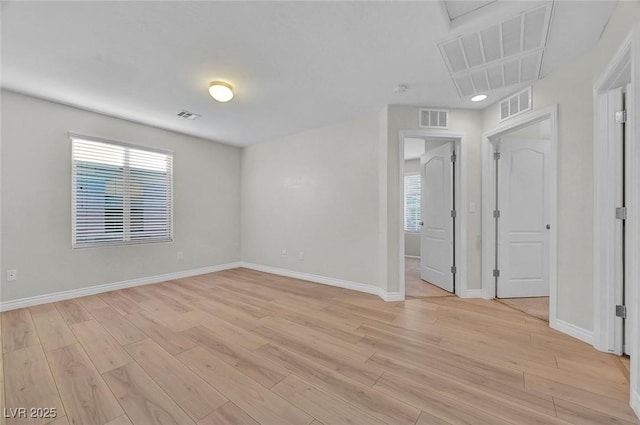 6373 Beavertail Pond Ave, Las Vegas, NV 89122 - empty room featuring light wood-style flooring