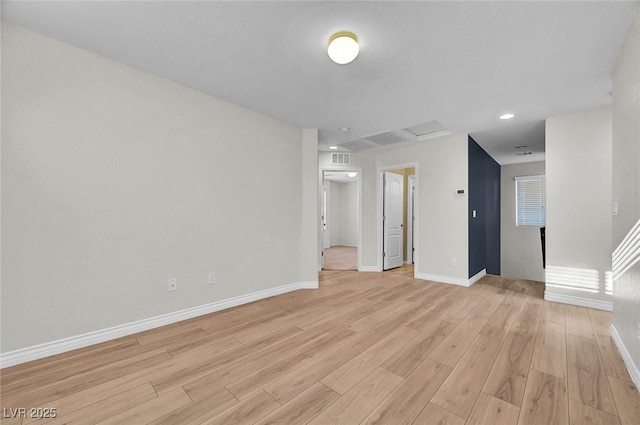 6373 Beavertail Pond Ave, Las Vegas, NV 89122 - unfurnished living room featuring light wood-style floors and recessed lighting