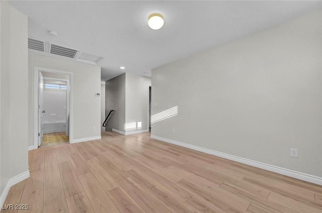 6373 Beavertail Pond Ave, Las Vegas, NV 89122 - unfurnished room featuring light wood-type flooring and recessed lighting