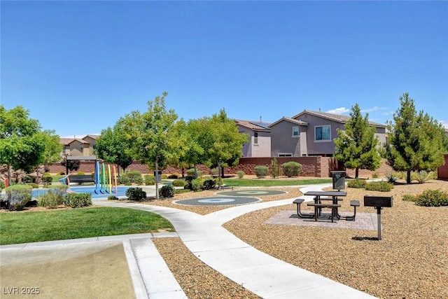 6373 Beavertail Pond Ave, Las Vegas, NV 89122 - surrounding community featuring a lawn