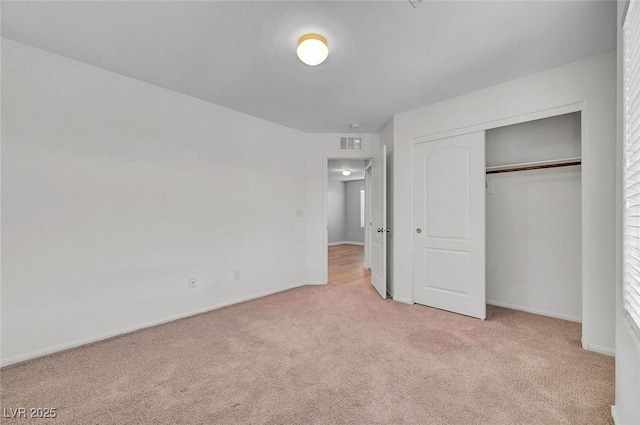 6373 Beavertail Pond Ave, Las Vegas, NV 89122 - unfurnished bedroom featuring light colored carpet and a closet