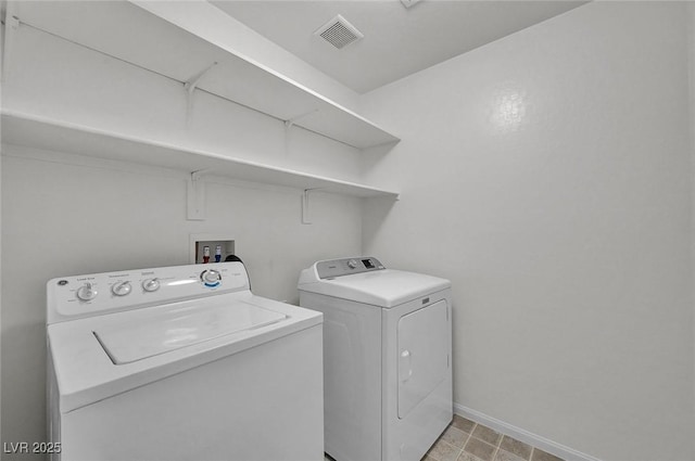 6373 Beavertail Pond Ave, Las Vegas, NV 89122 - laundry room with washing machine and dryer and baseboards