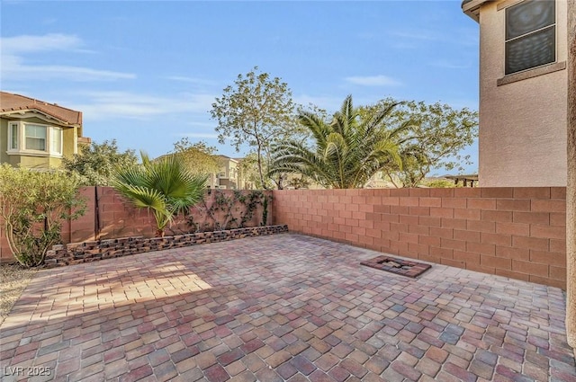 6373 Beavertail Pond Ave, Las Vegas, NV 89122 - fenced backyard with a patio area