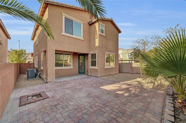 6373 Beavertail Pond Ave, Las Vegas, NV 89122 - rear view of house with stucco siding, a fenced backyard, and a patio