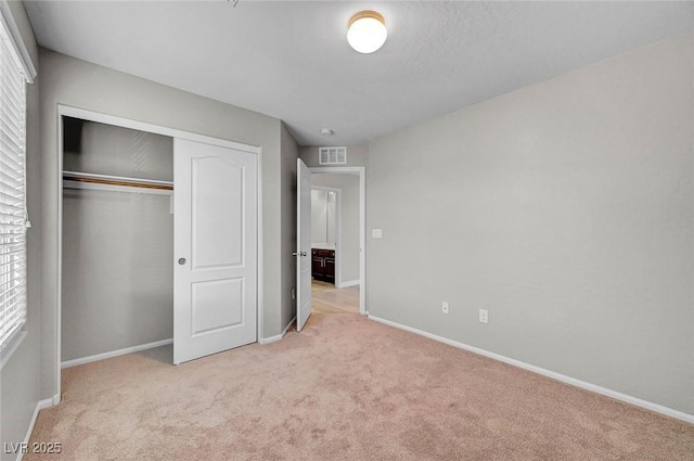 6373 Beavertail Pond Ave, Las Vegas, NV 89122 - unfurnished bedroom with light colored carpet and a closet