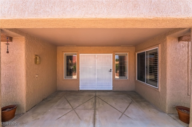 8904 Marble Dr, Las Vegas, NV 89134 - property entrance with a patio area and stucco siding