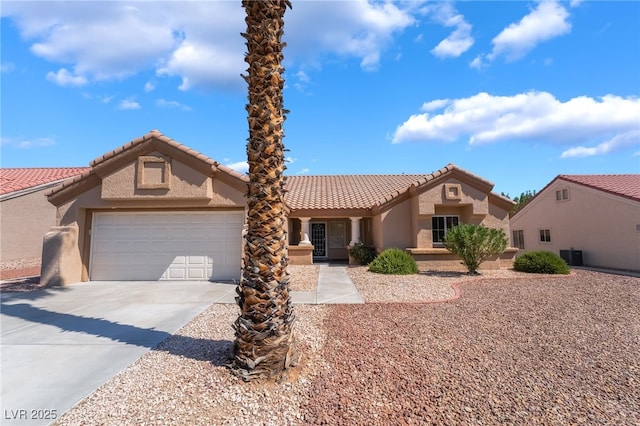 8904 Marble Dr, Las Vegas, NV 89134 - mediterranean / spanish-style home with concrete driveway, an attached garage, stucco siding, and a tile roof