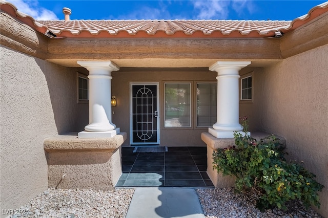 8904 Marble Dr, Las Vegas, NV 89134 - entrance to property featuring a porch, stucco siding, and a tile roof