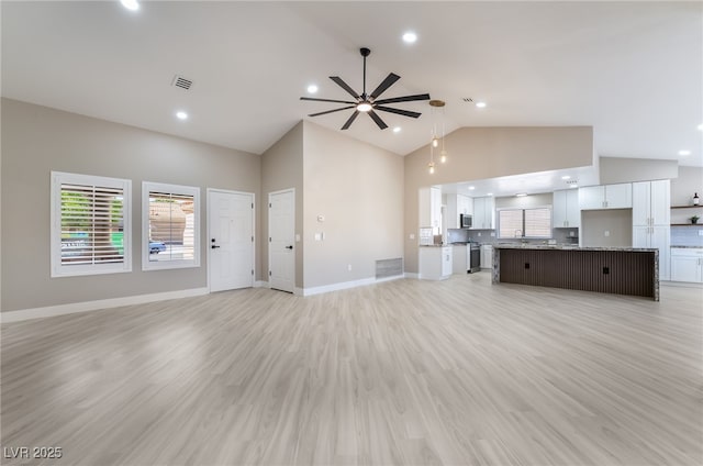 8904 Marble Dr, Las Vegas, NV 89134 - unfurnished living room with a ceiling fan, high vaulted ceiling, light wood finished floors, and recessed lighting
