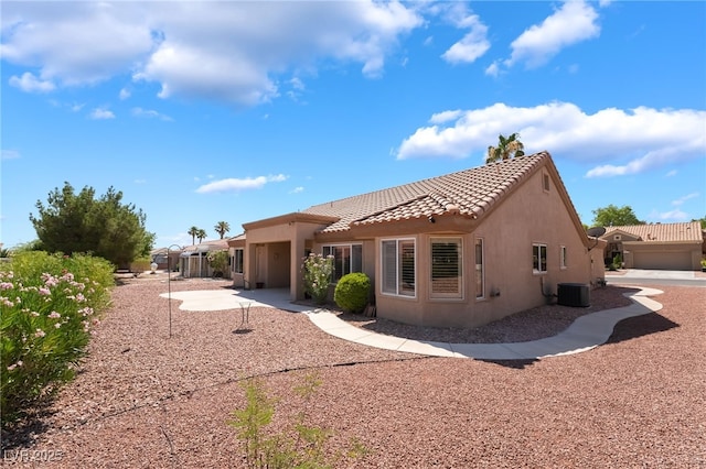 8904 Marble Dr, Las Vegas, NV 89134 - rear view of house with a tile roof and stucco siding