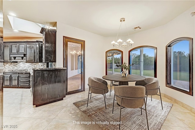 7751 Radcliff St, Las Vegas, NV 89123 - dining room with a chandelier and light tile patterned flooring