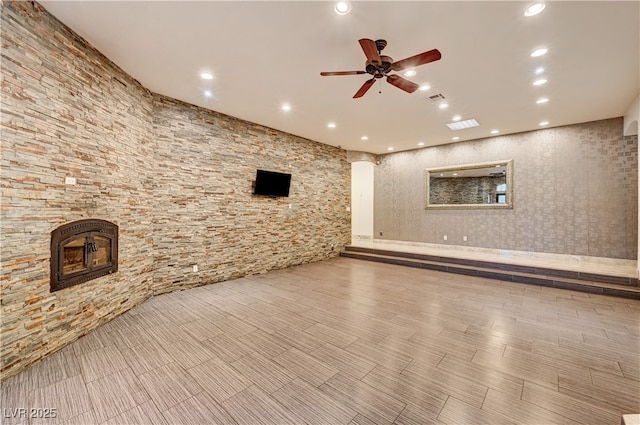7751 Radcliff St, Las Vegas, NV 89123 - unfurnished living room featuring ceiling fan, recessed lighting, and a glass covered fireplace