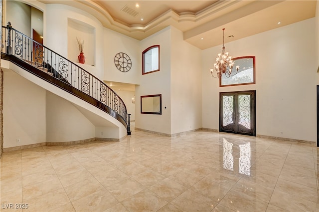 7751 Radcliff St, Las Vegas, NV 89123 - foyer entrance with a high ceiling, stairs, a chandelier, a raised ceiling, and recessed lighting