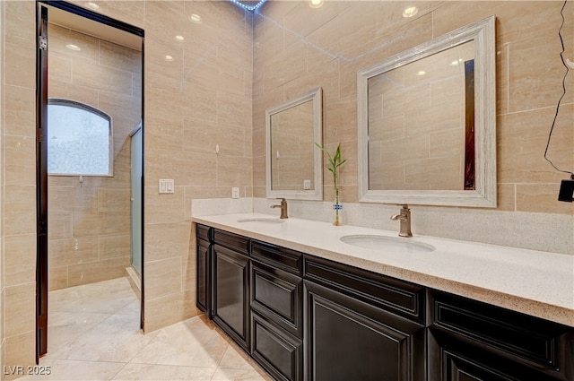 7751 Radcliff St, Las Vegas, NV 89123 - bathroom featuring double vanity, tile walls, and a shower stall